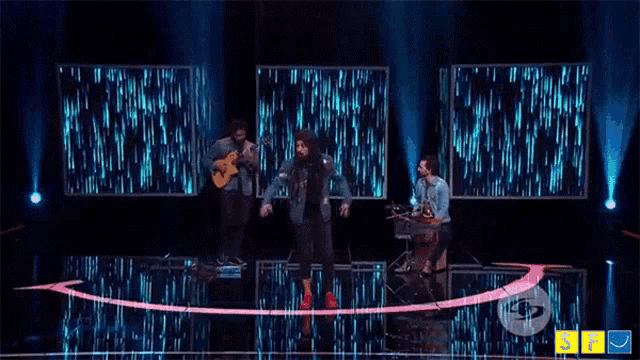 a group of men are playing instruments on a stage in front of a sign that says ' nf '