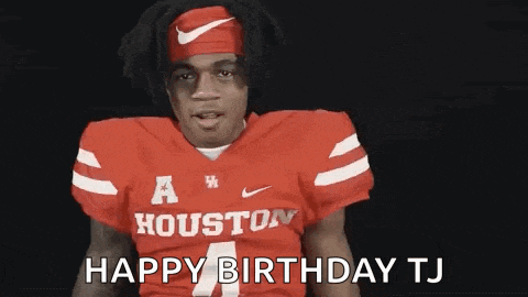 a football player wearing a red jersey and a headband is saying happy birthday .