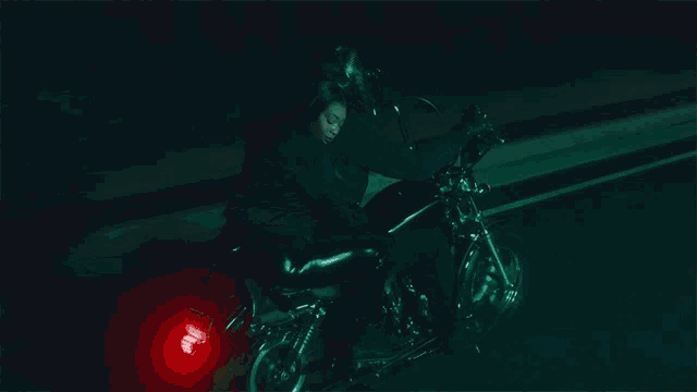 a person riding a motorcycle with a license plate that says ' aa '