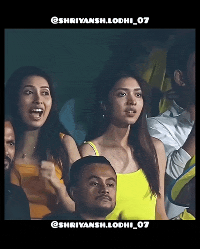 a woman in a yellow tank top stands in a crowd with the hashtag shriyansh.lodhi_07