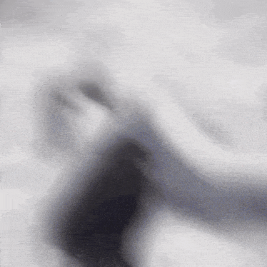 a blurred image of a person 's face with a white background