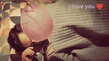 a man blowing up a pink balloon with the words " i love you " below him