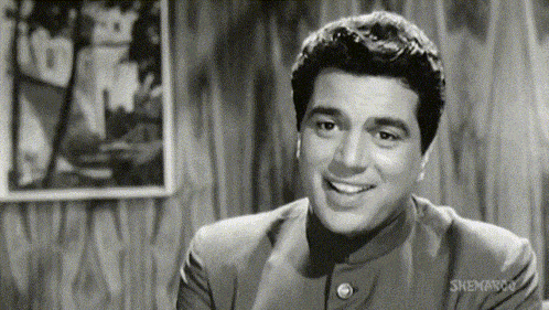 a black and white photo of a smiling man with a watermark that says ' shemaroo ' on the bottom