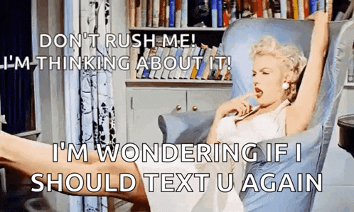 a woman in a white dress is sitting in a chair with her legs crossed and says " don 't rush me "