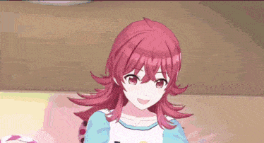 a girl with red hair is wearing a blue and white shirt .