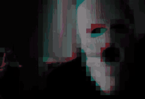 a man in a ski mask is smoking a cigarette .