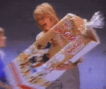 a blurry picture of a person holding a box of coca cola