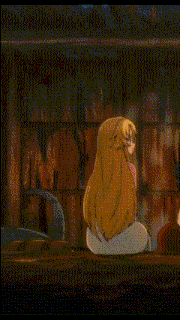 a cartoon drawing of a mermaid sitting on the ground