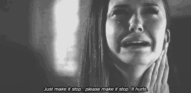 a woman is crying with the words just make it stop please make it stop it hurts written below her