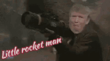donald trump is crying while holding a rocket launcher and says little rocket man .