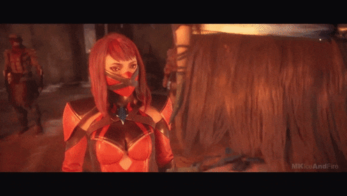 a woman in a red costume is standing next to a man in a red costume .