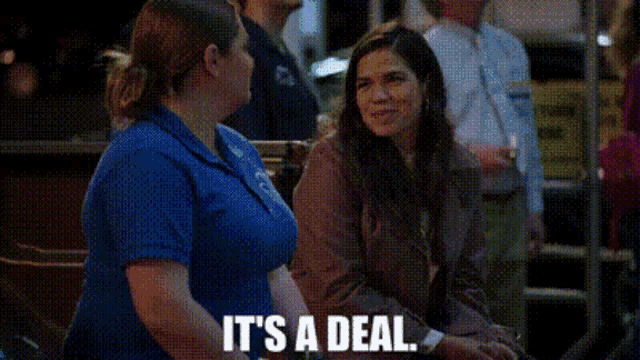 two women are sitting next to each other and one of them is saying `` it 's a deal `` .