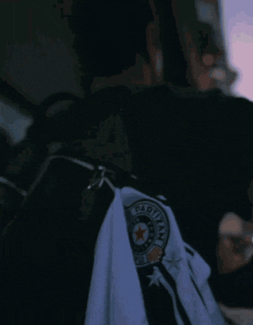 a man wearing a black t-shirt that says ' abercrombie & fitch ' on it