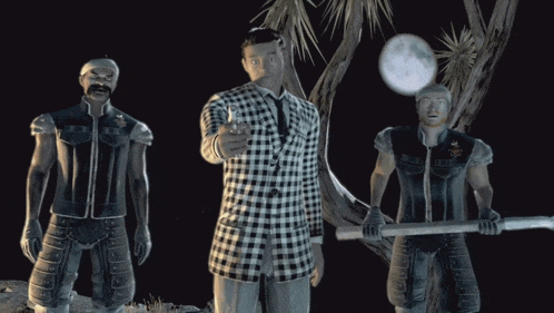 a man in a plaid suit stands between two other men in armor