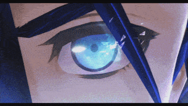 a close up of a person 's eye with a blue glow