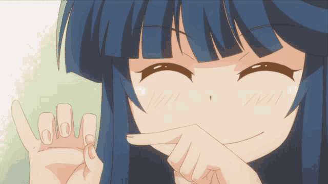 a girl with blue hair is smiling and covering her face with her hand