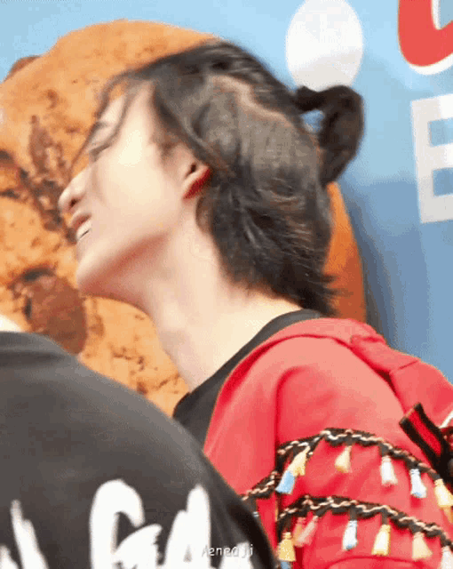 a person wearing a red shirt that says ' a good day ' on the back