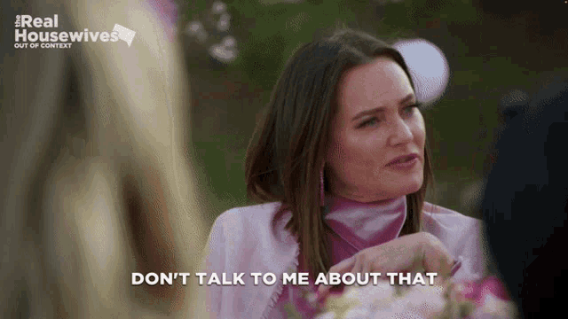 a woman in a pink jacket says do n't talk to me about that ..