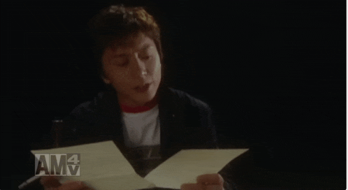 a person holding a piece of paper with the word amv on the bottom