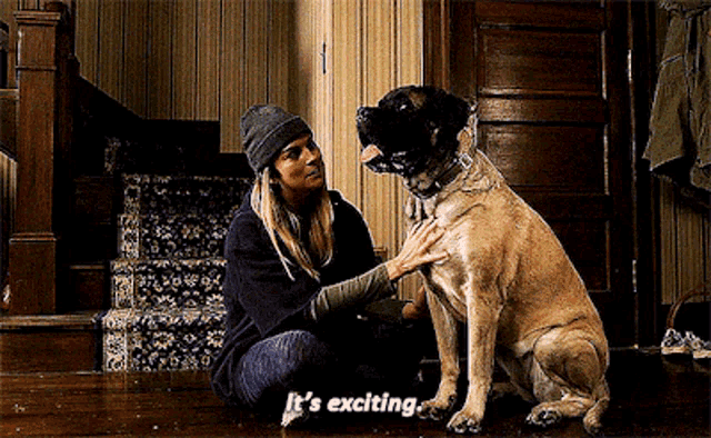 a woman petting a dog with the words it 's exciting