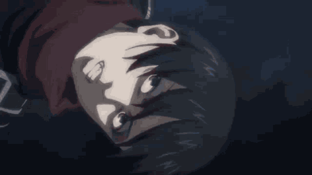 a close up of a person 's face in a dark room looking up at the sky .