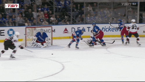 a hockey game is being played in front of a delta airlines banner