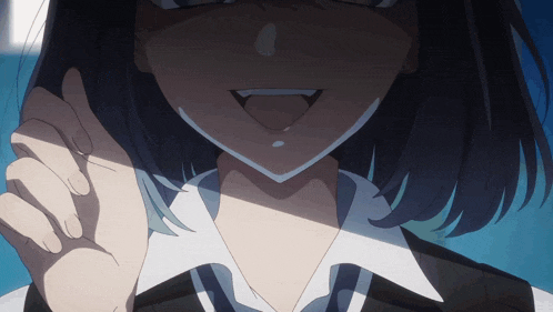 a close up of a woman 's face with her tongue hanging out