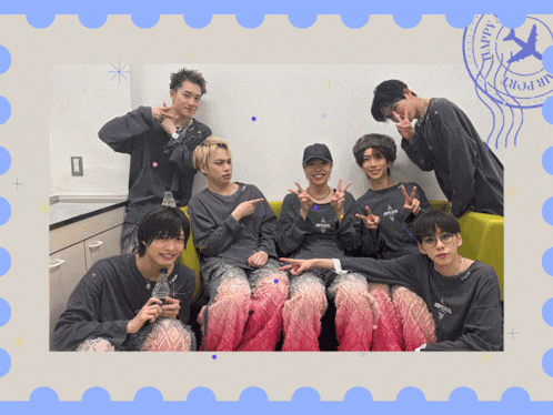 a group of young men posing for a picture with a stamp that says happy journey