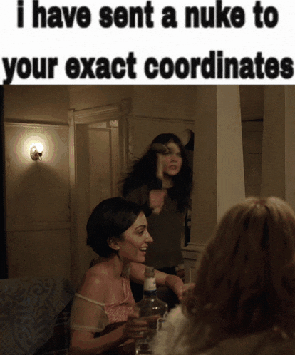 two women sitting at a table with a caption that says " i have sent a nuke to your exactcoordinates "