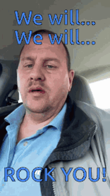 a man sitting in a car with the words " we will rock you " written above him