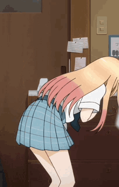 a girl in a blue plaid skirt is standing in a room