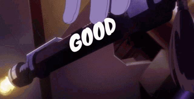 a person is holding a purple object that says good