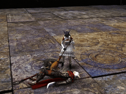 a woman in a white dress is standing next to a man laying on the floor