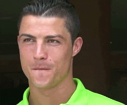 a close up of a man 's face wearing a neon green shirt