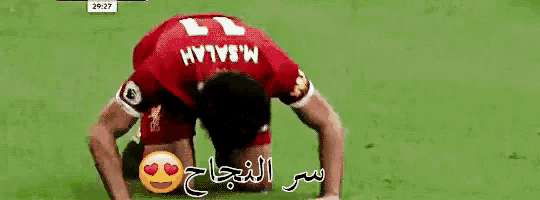 a soccer player in a red jersey with the word liverpool on the front