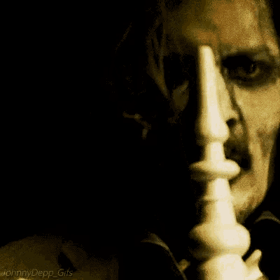 a close up of a man 's face with the words johnny depp gifs on the bottom right