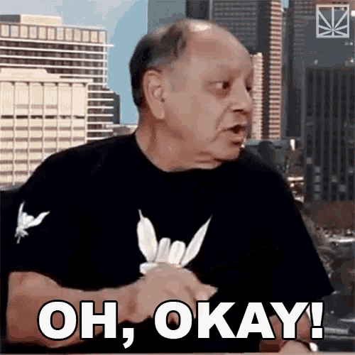 a man in a black shirt is saying " oh okay "