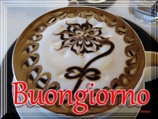 a cup of cappuccino with a flower design and the words buongiorno on the bottom