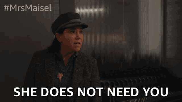 a woman says she does not need you in front of a glass wall