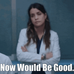 a woman in a lab coat is standing with her arms crossed and the caption now would be good