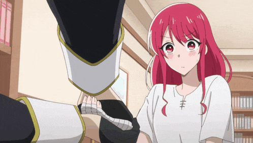 a girl with red hair is standing next to a man with black gloves