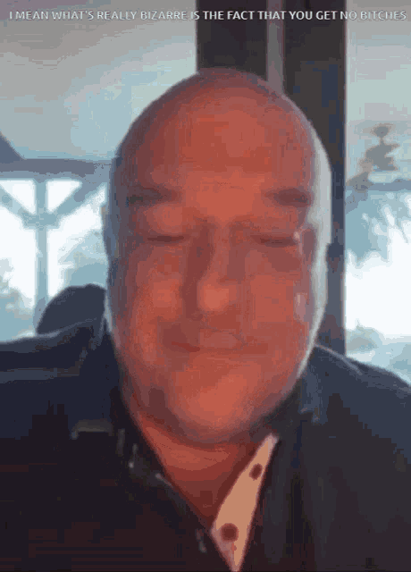 a bald man with his eyes closed says i mean what 's reality bizarre