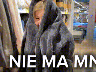a woman is wrapped in a blanket and the words nie mamn are on the bottom
