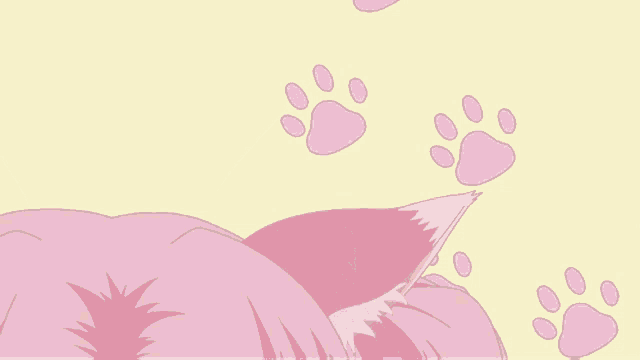 a close up of a cat 's ears and paw prints on a yellow background