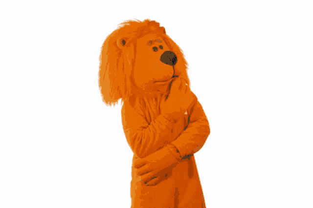 a lion mascot with arms crossed and a lion head
