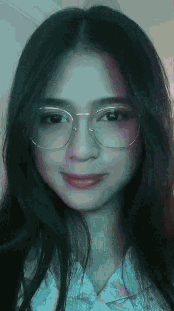 a close up of a woman wearing glasses