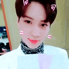 a close up of a person 's face with a cat ear on their head