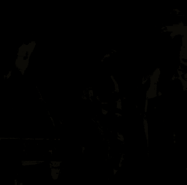 two women are standing next to each other with the word kiss in the corner