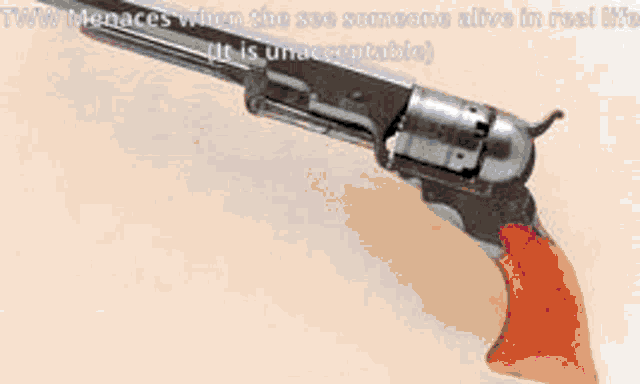 a picture of a gun with a caption that says tww menace when the see someone alive in real life