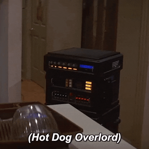 a stack of electronics with the words hot dog overlord written below them